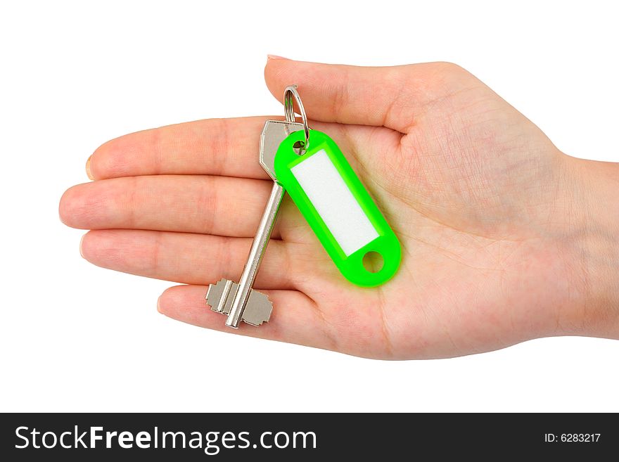 Hand and key with label isolated on white background