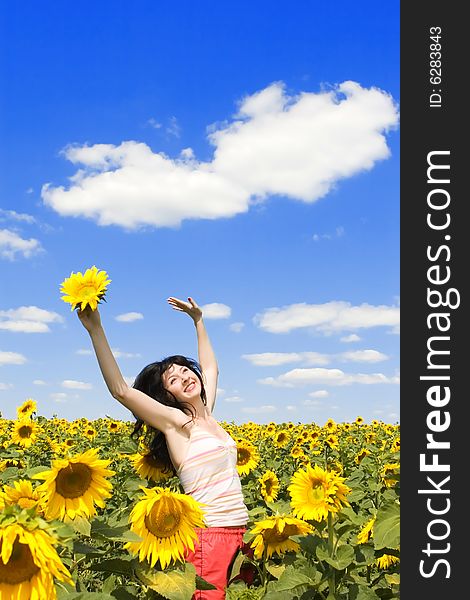 Woman in the field of sunflowers