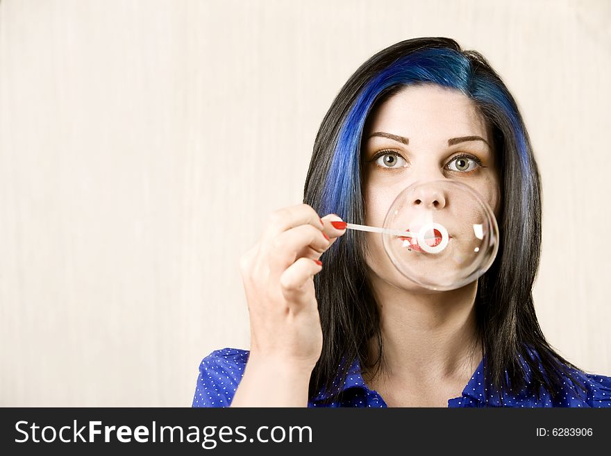 Pretty with Pretty Eyes Woman Blowing a Large Bubble. Pretty with Pretty Eyes Woman Blowing a Large Bubble