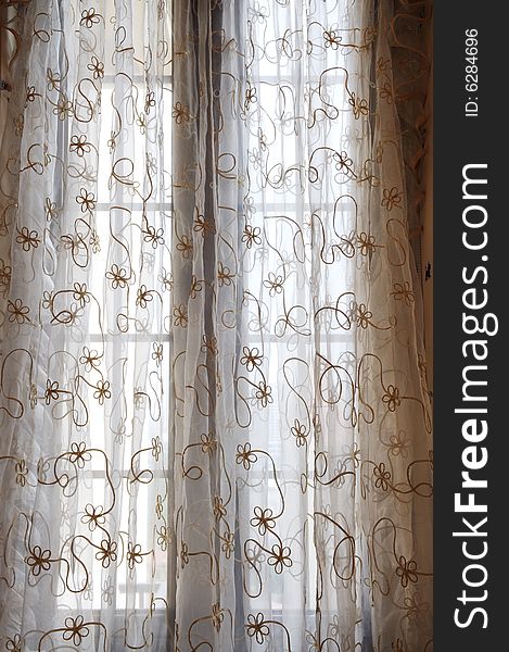 The soft voile curtain with flower pattern.