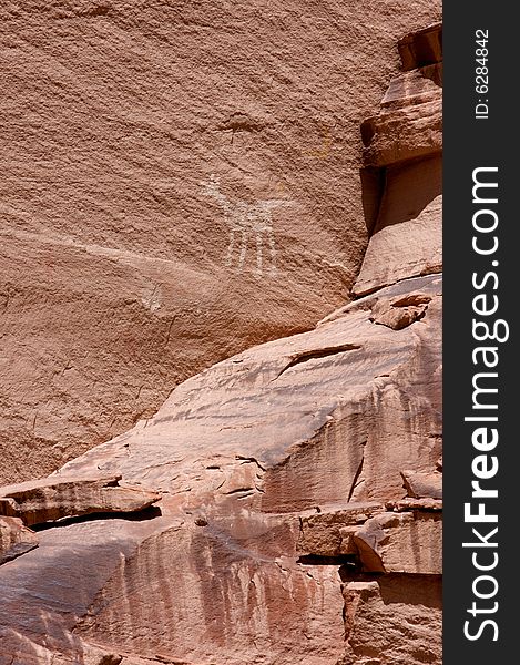 An image of carvings and ancient art on canyon walls