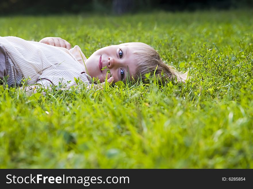 Happy boy lying in grass. Happy boy lying in grass