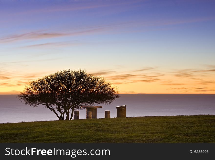 Public picnic area near coast at dusk - landscape exterior