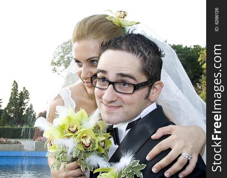 Happy, just married couple kissing in nature. Wedding and marriage concept. Happy, just married couple kissing in nature. Wedding and marriage concept