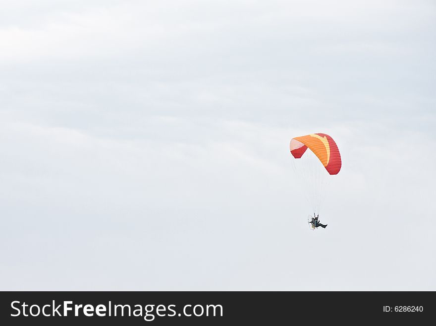 Single paraglider on a cloudy day - landscape exterior
