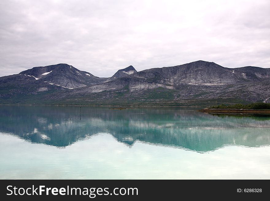 Norway landscape, fjord and mountains in the background