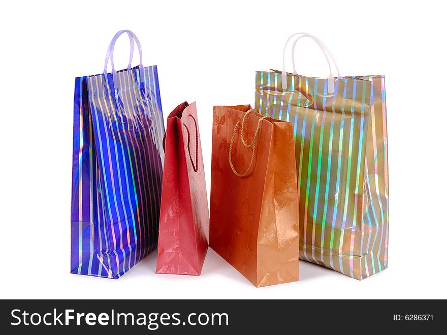 Group of colorful shopping bags over white background