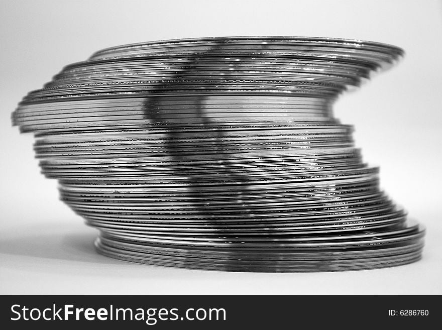 Black and white image of a crooked stack of dvds. Black and white image of a crooked stack of dvds