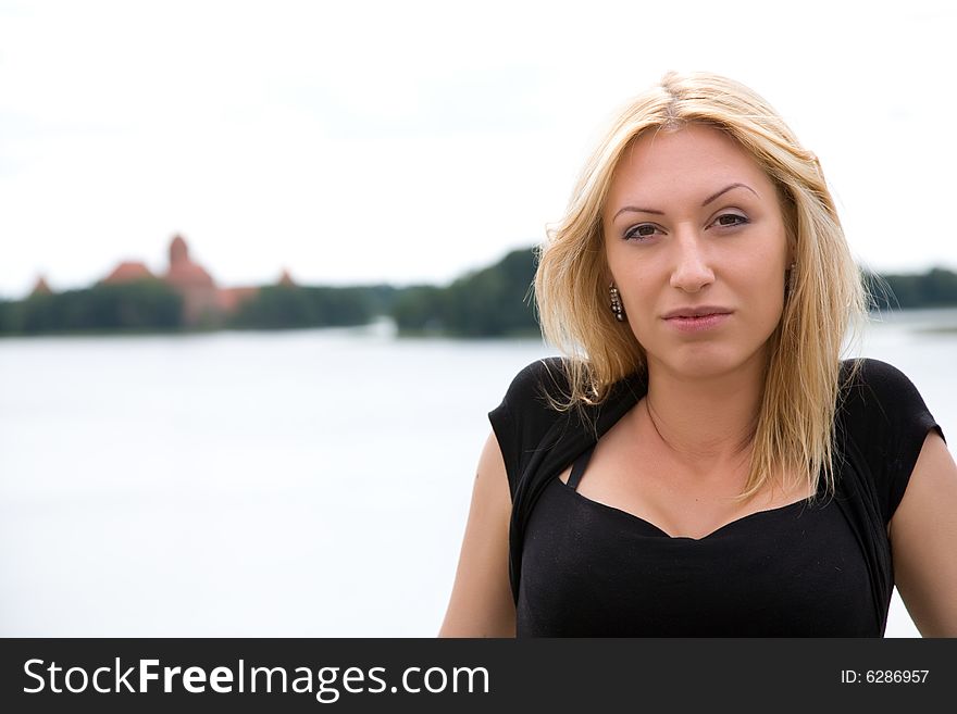 Portrait of the beautiful young girl on nature