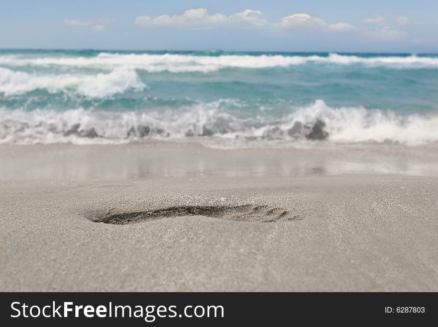 Close up of footprint on sand beach