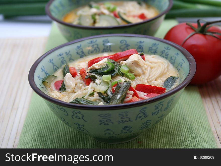 A meal of japanese soup with noodles and vegetables. A meal of japanese soup with noodles and vegetables