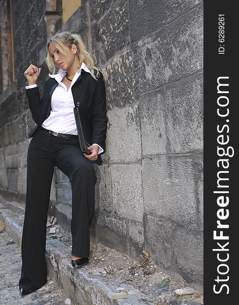 Pretty businesswomen  suit on the street thinking. Pretty businesswomen  suit on the street thinking