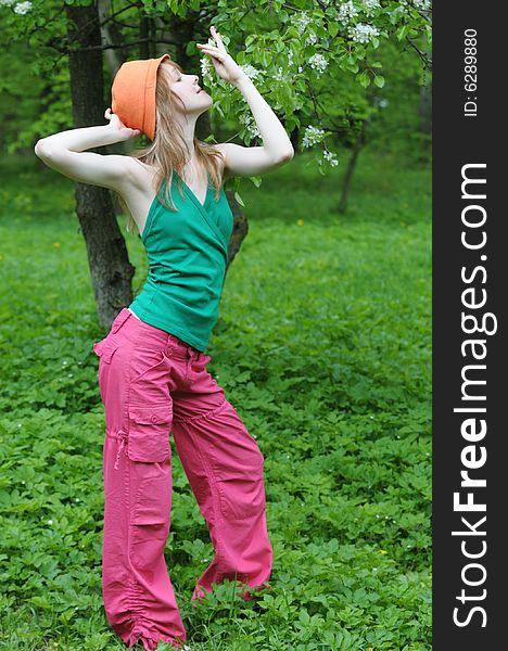 Happy young girl posing in the park. Happy young girl posing in the park