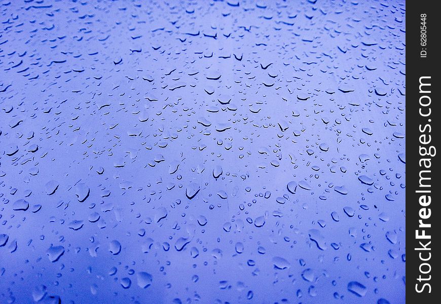 Background with water drops on the blue window. Background with water drops on the blue window