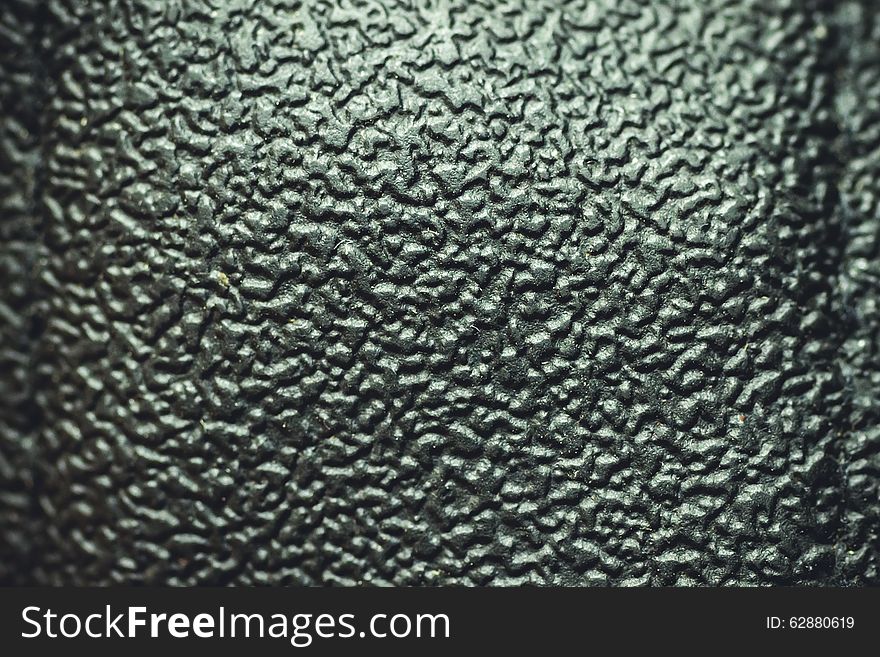 Texture of black leather looks unusually light