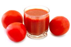 Fresh Tomato Juice In Glass And Tomatoes. Stock Images Fresh Tomato Juice In Glass And Tomatoes. Stock Images