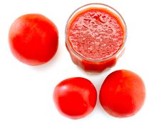 Fresh Tomato Juice In Glass And Tomatoes. Royalty Free Stock Photography Fresh Tomato Juice In Glass And Tomatoes. Royalty Free Stock Photography