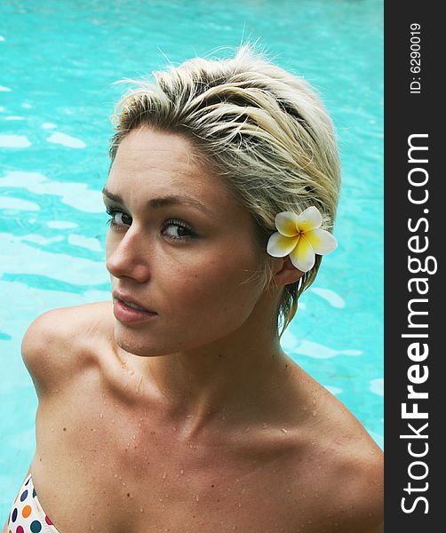 Beautiful blond woman in a swimming pool.