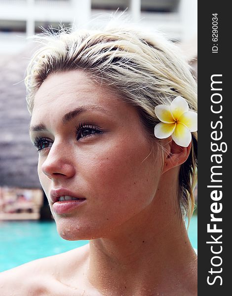 Beautiful blond woman in a swimming pool.