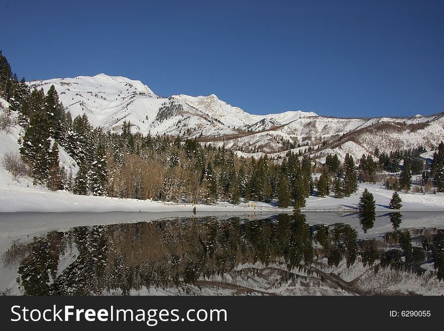 Mountain Lake showing snowy reflections. Mountain Lake showing snowy reflections