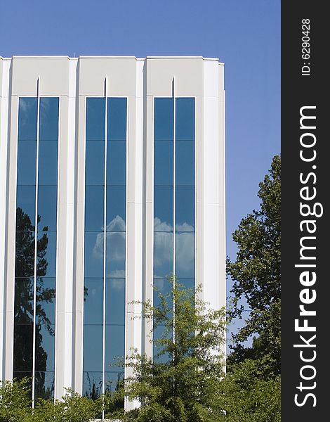 Clouds Reflected in White Building