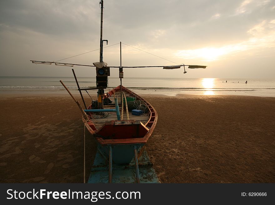 The big boat on a sunset Beach. The big boat on a sunset Beach