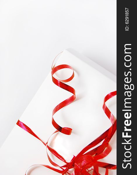 Gift box with red ribbon isolated on white background. Gift box with red ribbon isolated on white background