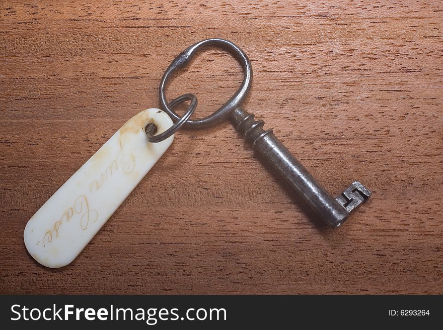 Antique key with badgeisolated on white background. Antique key with badgeisolated on white background