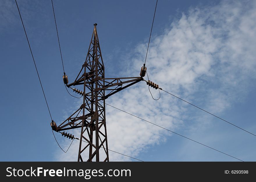 Pylon of electric main on a background of the blue sky