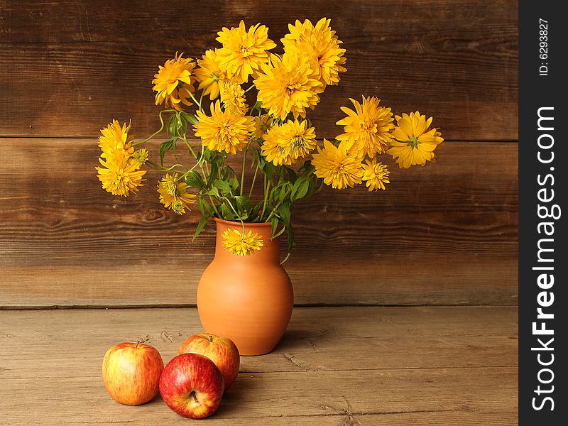 Autumn still life with apples and flowers