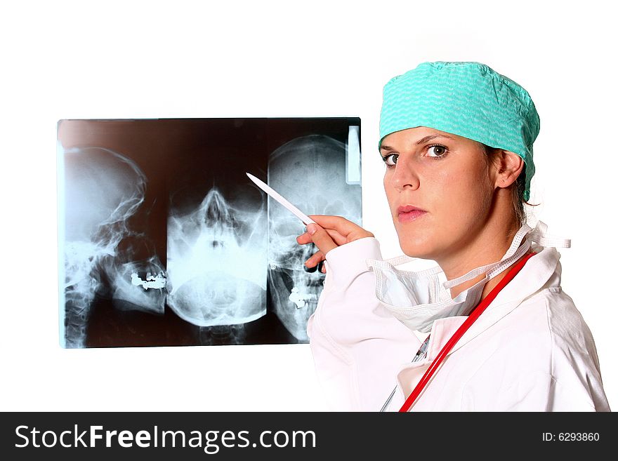 A young female doctor with a x-ray in the background and a stethoscope around the neck!. A young female doctor with a x-ray in the background and a stethoscope around the neck!