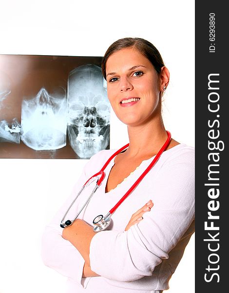 A beautiful young doctor with a red stethoscope and a xray image in the back. Isolated over white. A beautiful young doctor with a red stethoscope and a xray image in the back. Isolated over white.
