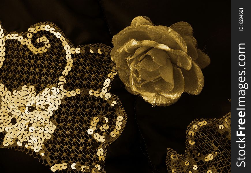 Gold rose and diamantes on black cloth