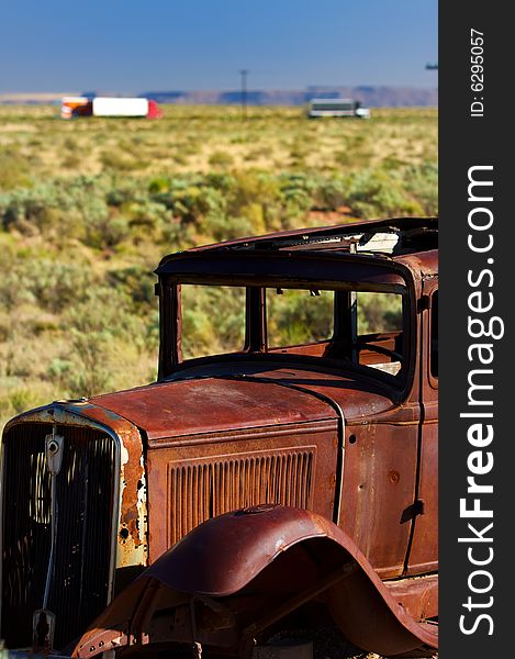 An image of a vintage rusted automobile. An image of a vintage rusted automobile