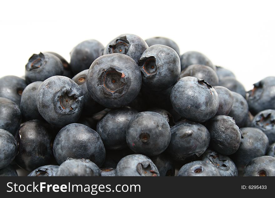 A group of blueberries isolated with a white background. A group of blueberries isolated with a white background.