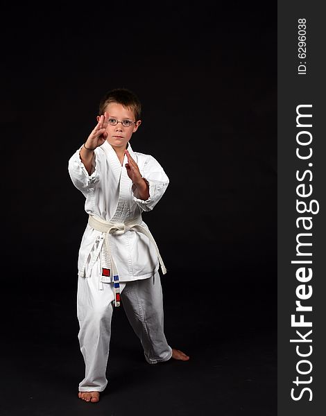 Traditional karate student demonstrating handblock and right stance