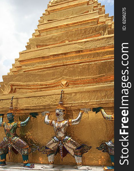 Golden temple with glaring sculpture in grand palace. Golden temple with glaring sculpture in grand palace.