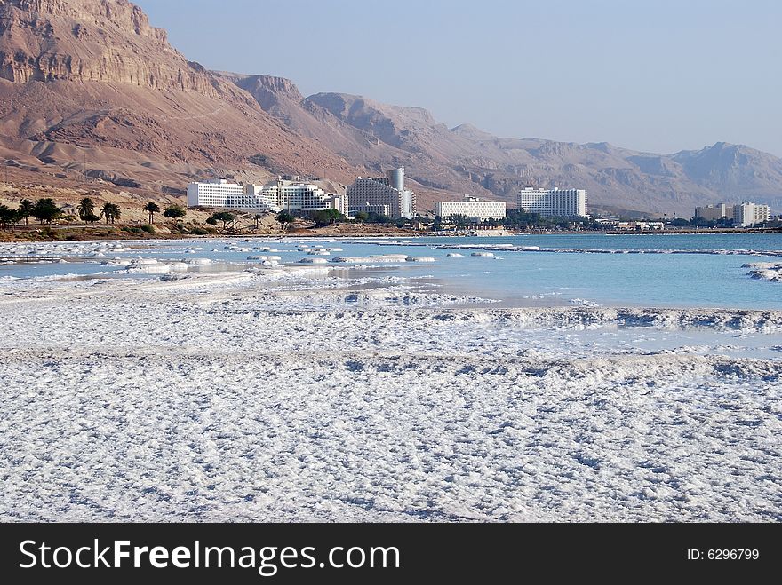 Dead Sea salt on coast and in water