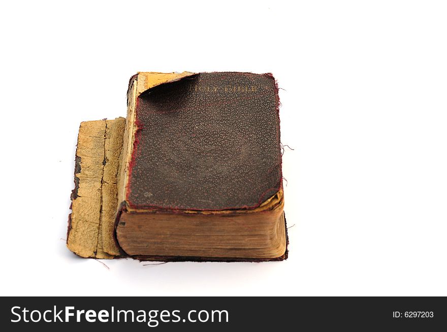 Shot of a very old and much used bible on white. Shot of a very old and much used bible on white