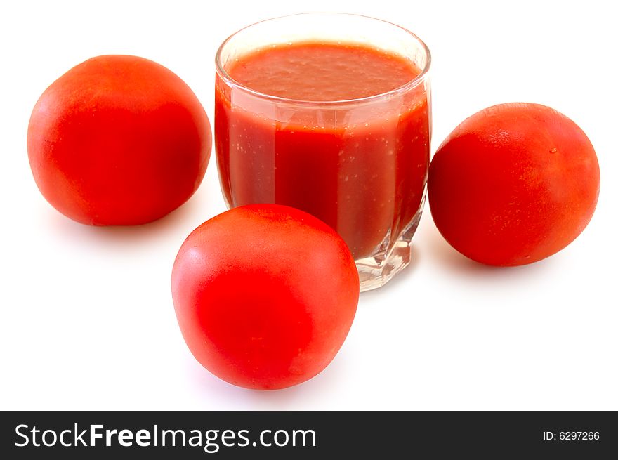 Fresh Tomato Juice In Glass And Tomatoes.