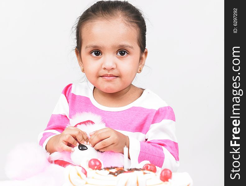 Girl with pink top and cake. Girl with pink top and cake