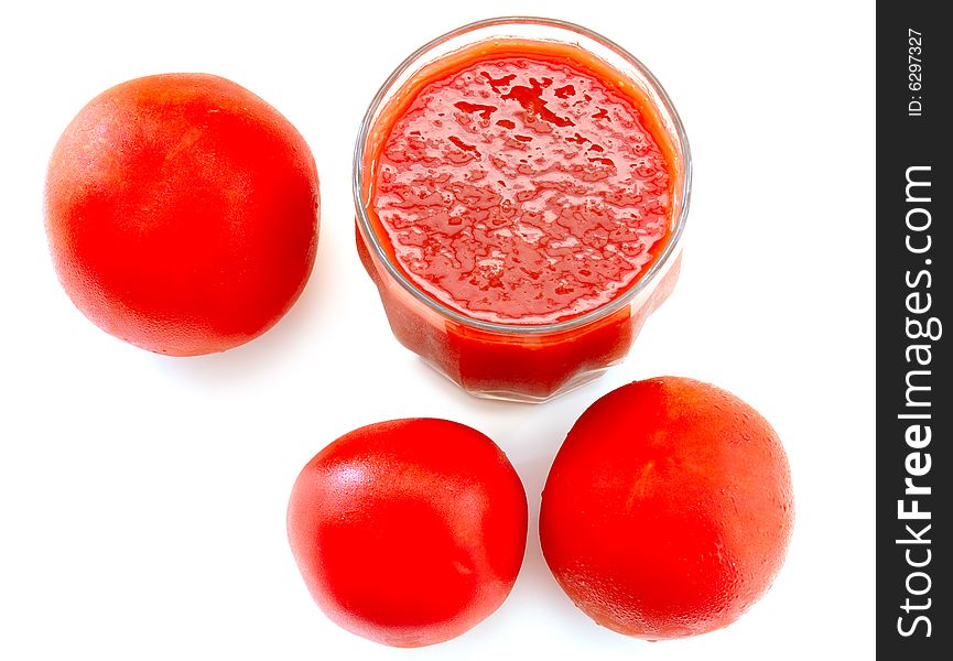 Fresh Tomato Juice In Glass And Tomatoes.