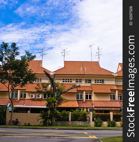 Tropical house exterior with red top roof