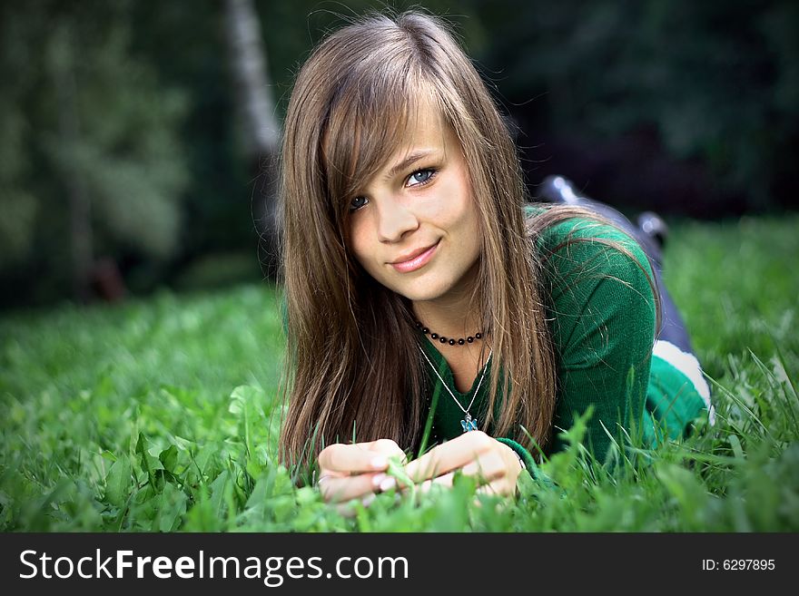 A Portrait Of A Gorgeous Girl On The Grass