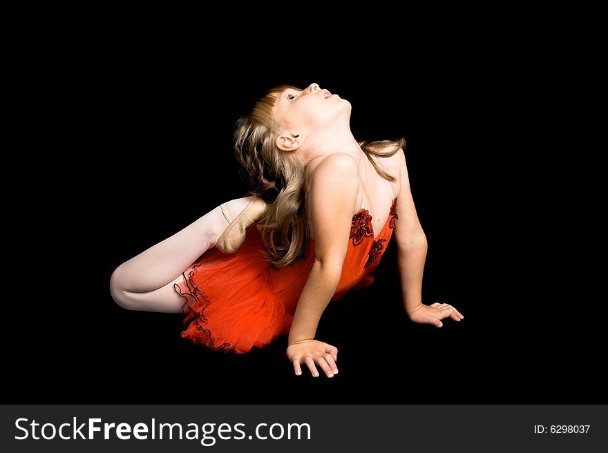 Young ballet dancer wearing a red costume. Young ballet dancer wearing a red costume