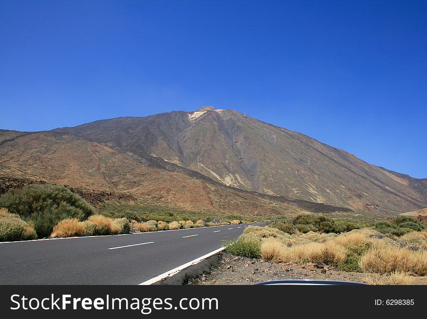 Lonely road at a high plateau leading to the Teide volcano in the Canary Island of Tenerife. Lonely road at a high plateau leading to the Teide volcano in the Canary Island of Tenerife