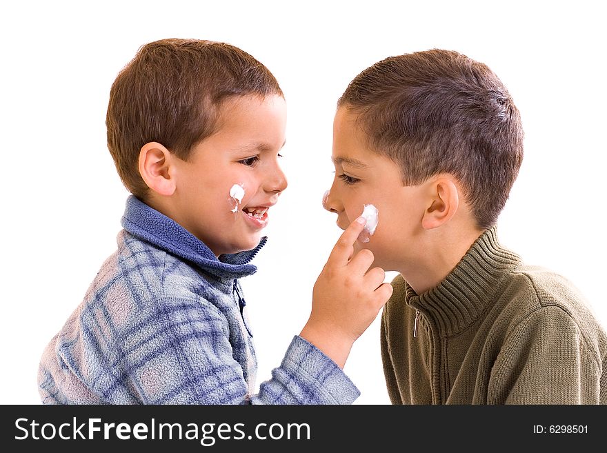 Children with pomade on the visage. Children with pomade on the visage