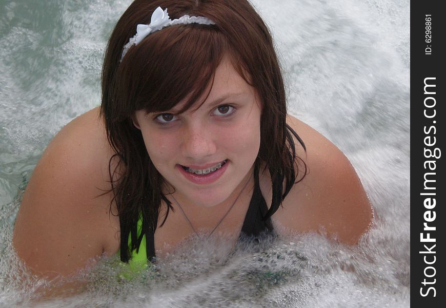 A picture of a cute young teen girl in a jacuzzi. A picture of a cute young teen girl in a jacuzzi.