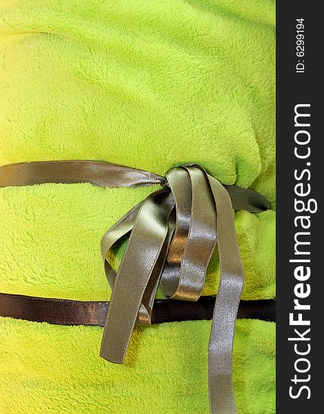 Background of green warm blanket cloth with bow