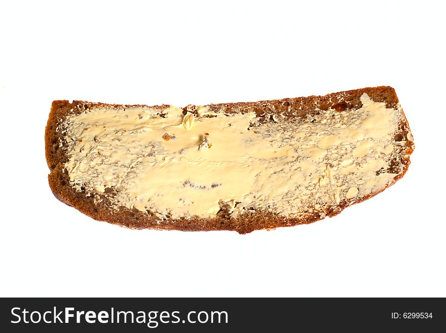 Dark bread with butter, photo on the white background